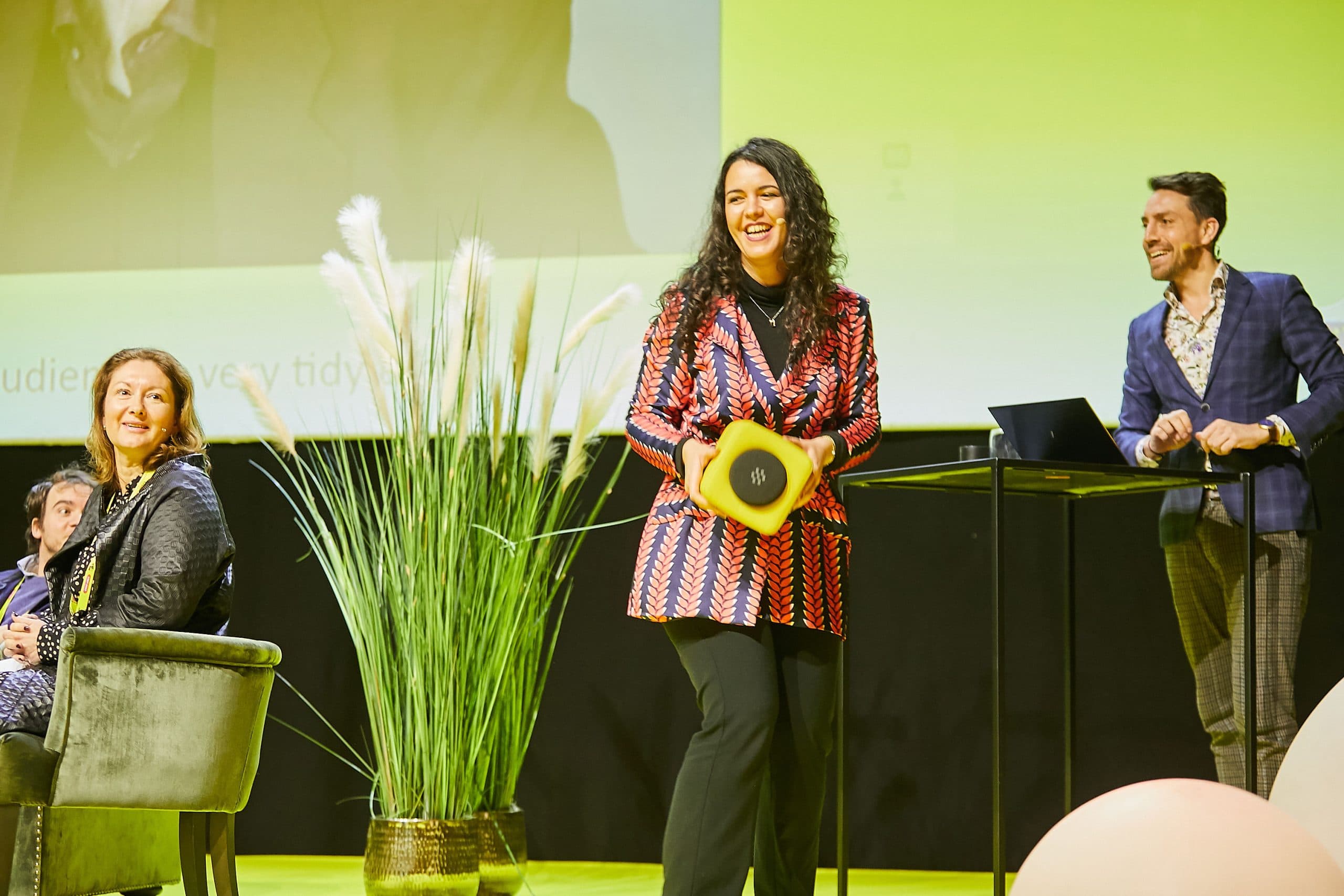 Host running an interactive session on a European stage