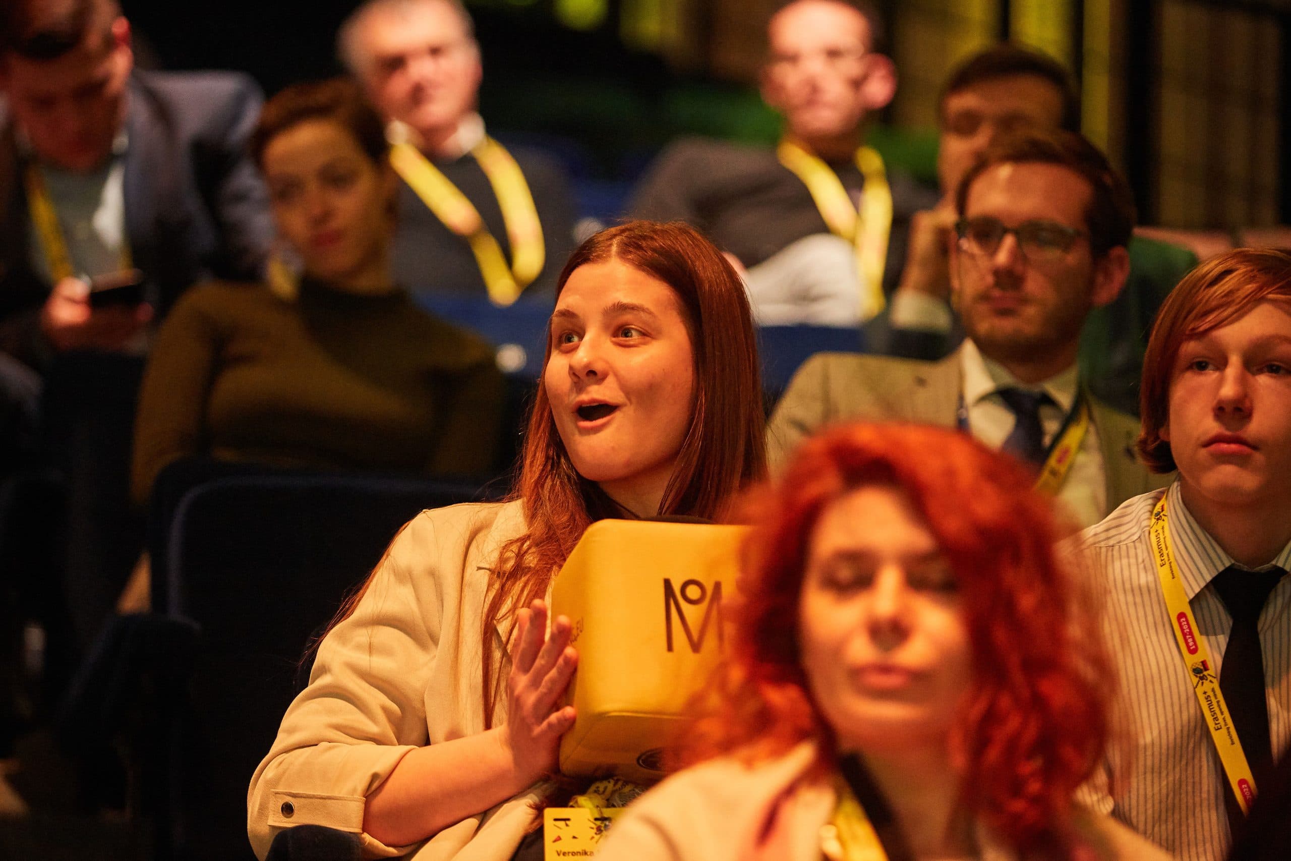 Audience reacting during a moderated European conference