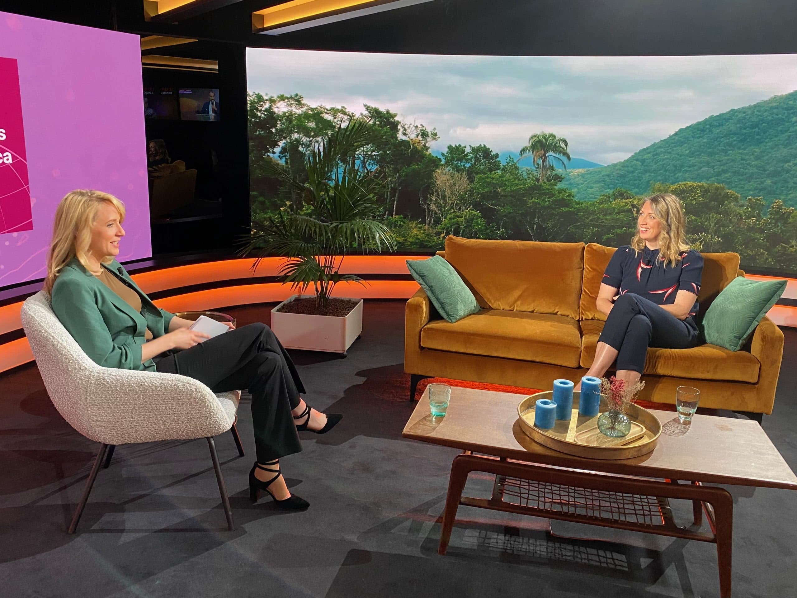 Talk-show set with screens, built for a remote audience